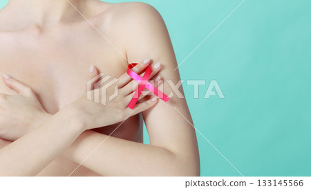 Naked woman with breast cancer awareness ribbon Naked woman with breast cancer awareness ribbon 133145566