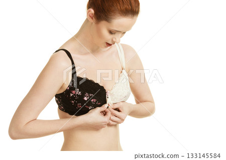 Girl of smooth body with brassiere dilemma. Girl of smooth body with brassiere dilemma. 133145584