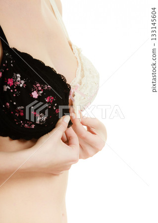 Lady with choice trying to choose perfect bra. 133145604
