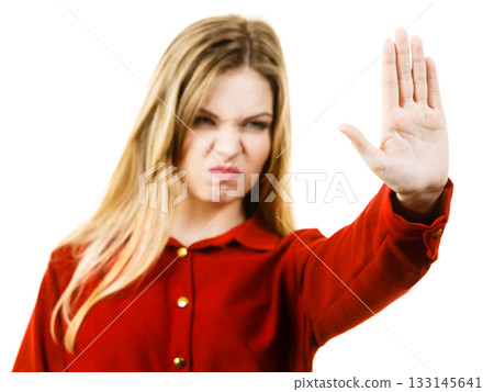 Woman showing stop gesture Woman showing stop gesture 133145641
