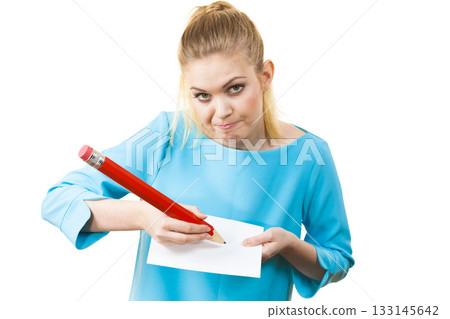 Woman with big pencil writing on paper 133145642