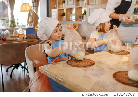 Kids enjoy cooking class at local bakery in the afternoon 133145708