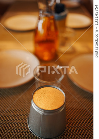 Enjoying a cozy meal with unique table setting 133145754