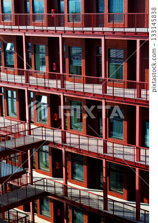 Sustainable cabins with natural materials on waterfront in Kvillepiren, Hisingen, sunny day, Gothenburg, Sweden 133145838