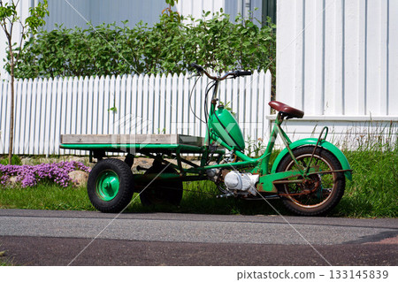 Flatbed moped parked on street of the peaceaful car-free Vrango island with seaside village in Gothenburg archipelago, Vrango, Sweden Flatbed moped parked on street of the peaceaful car-free Vrango island with seaside village in Gothenburg archipelago, Vrango, Sweden 133145839