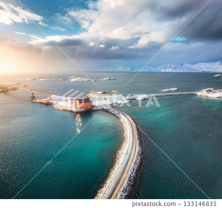 Aerial view of road and bridges, snowy islands with red rorbu Aerial view of road and bridges, snowy islands with red rorbu 133146835
