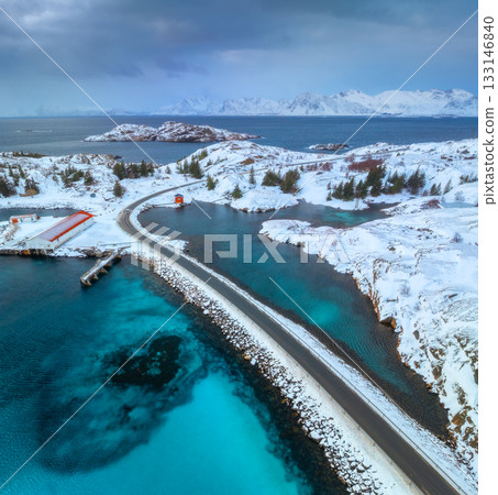 Aerial view of road, island in snow, rorbu, sea, bridge Aerial view of road, island in snow, rorbu, sea, bridge 133146840