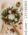 Hands Making Rustic Christmas Wreath - DIY Holiday Crafting Flat Lay 133146902
