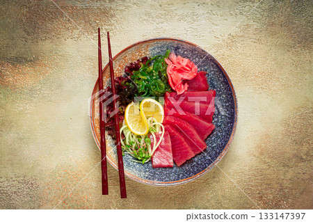 tuna sashimi with daikon and wakame salad, pickled ginger, in a bowl, tuna sashimi with daikon and wakame salad, pickled ginger, in a bowl, 133147397