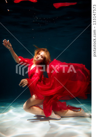 Dreamlike underwater setting featuring performer as mermaid 133147573