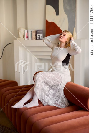 Thoughtful caucasian woman posing for fashion still - creative 133147602