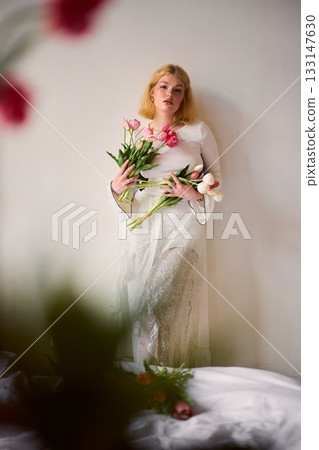 caucasian woman artist muse holding tulips in reflection caucasian woman artist muse holding tulips in reflection 133147630