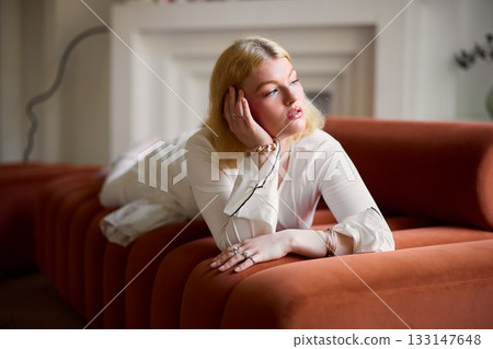 Elegant woman relaxing, Whitehaired lady in tranquil setting Elegant woman relaxing, Whitehaired lady in tranquil setting 133147648