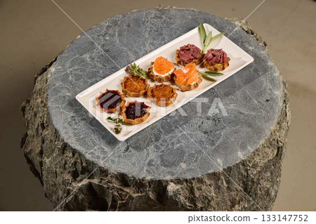Gourmet Canaps on a Stone Platter Gourmet Canaps on a Stone Platter 133147752