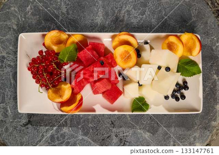 A delightful Fresh Summer Fruit Platter featuring colorful Watermelon and various Berries A delightful Fresh Summer Fruit Platter featuring colorful Watermelon and various Berries 133147761