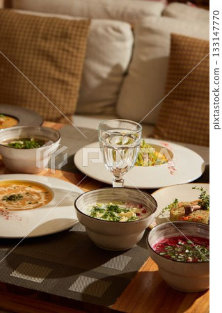 Enjoy gourmet soups paired with refreshing beverages to enhance your dining experience 133147770