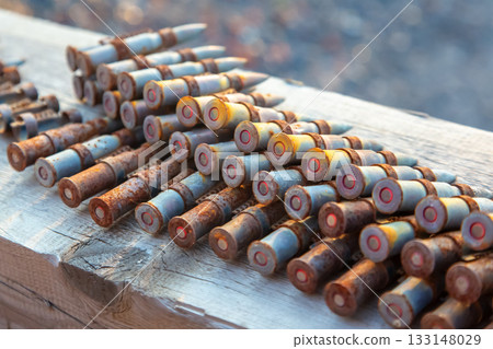 old rusty cartridges in a machine-gun belt. war in Ukraine. military ammunition 133148029