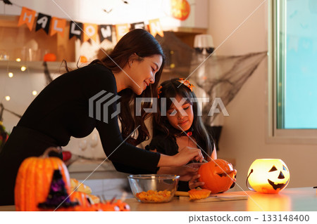 Creative Halloween Pumpkin Carving with Mother and Daughter 133148400
