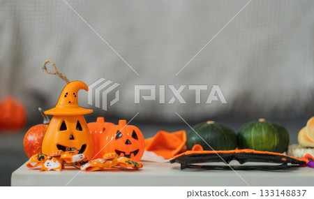 Halloween Decorations. Colorful pumpkin and spooky items arranged for festive celebration. Halloween Decorations. Colorful pumpkin and spooky items arranged for festive celebration. 133148837