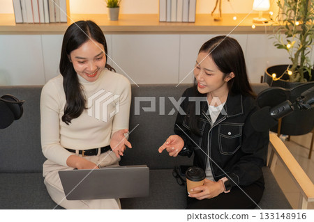 LGBTQIA friends discussing ideas in a cozy podcast studio 133148916