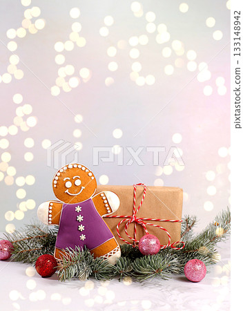 Holiday gift box, gingerbread and Christmas decorations on fir snowy branches, Christmas Eve concept, store advertising banner for New Year sales, Happy New Year. 133148942