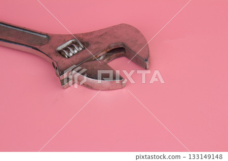 Wrench on a pink background 133149148
