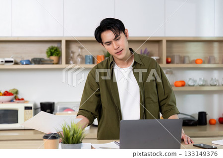 Working from Home. Reviewing Documents with Concentration 133149376