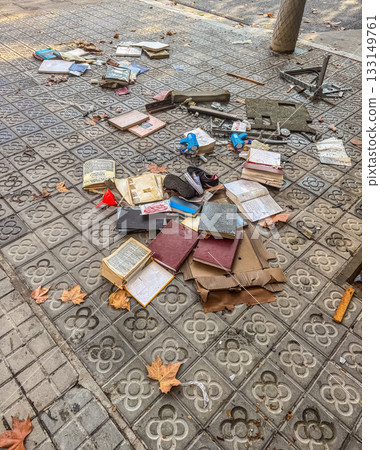 Discarded Books and Items on City Sidewalk 133149761