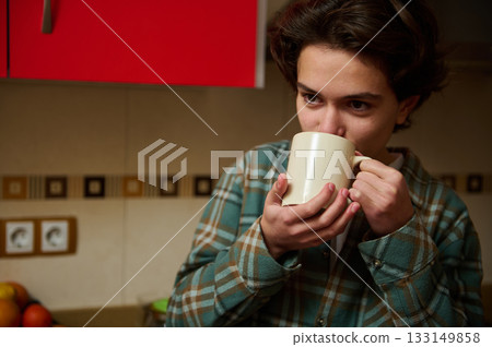 Teenage Boy Drinking Coffee In Kitchen, Morning Routine, Cozy Home Scene Teenage Boy Drinking Coffee In Kitchen, Morning Routine, Cozy Home Scene 133149858