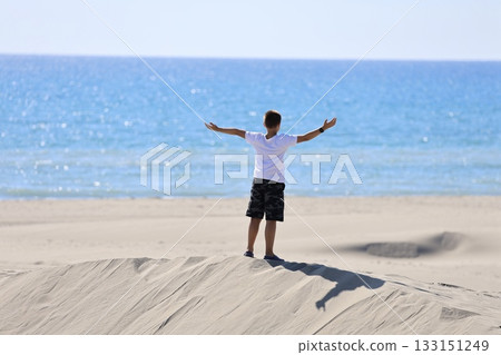 Beach dunes mountains natural beauty. boy alone in the desert. High quality 4k footage 133151249