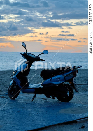 Scooter beach sunset. High quality photo 133151279