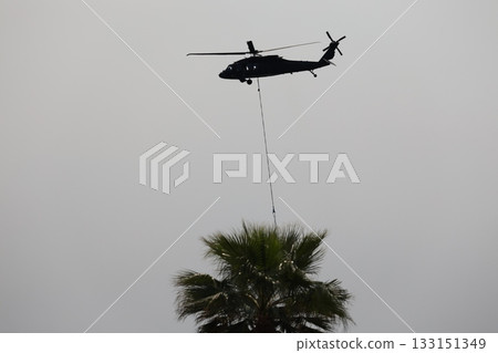 Bucket carrying helicopter. High quality photo Bucket carrying helicopter. High quality photo 133151349