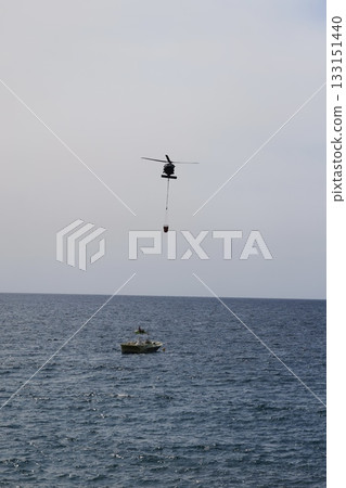 Bucket carrying helicopter. High quality photo Bucket carrying helicopter. High quality photo 133151440