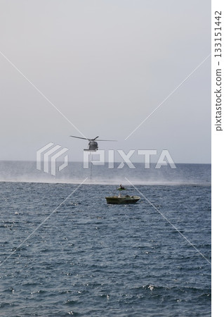 Bucket carrying helicopter. High quality photo Bucket carrying helicopter. High quality photo 133151442