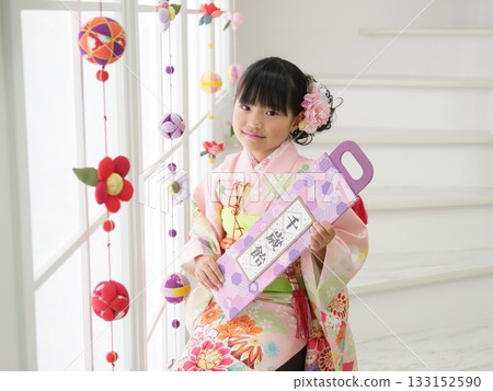 Girl holding Chitose-ame 133152590