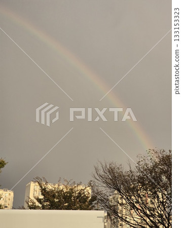 a rainbow after a rain in the city a rainbow after a rain in the city 133153323