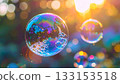 Iridescent soap bubbles float in sunlight 133153518