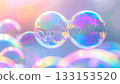Rainbowhued bubbles glisten in a dreamlike world 133153520
