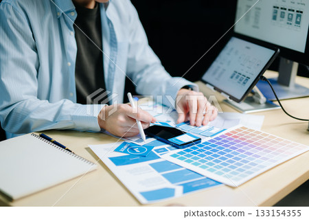 UX graphic designer planning application process development prototype wireframe for web smart phone. UX graphic designer planning application process development prototype wireframe for web smart phone. 133154355