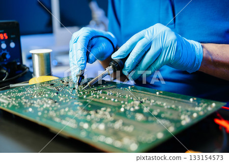Electronics technician, electronic engineering electronic repair, electronics measuring and testing, repair and maintenance concepts. Electronics technician, electronic engineering electronic repair, electronics measuring and testing, repair and maintenance concepts. 133154573