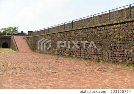 Aguada Fort is a built in 1612 along with a lighthouse, located on Sinquerim Beach in Goa, India, overlooking the Arabian Sea. The fort is a major tourist attraction. 133156754