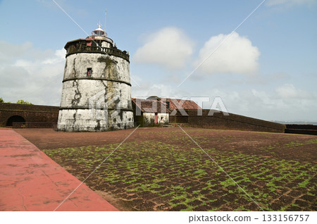Aguada Fort is a built in 1612 along with a lighthouse, located on Sinquerim Beach in Goa, India, overlooking the Arabian Sea. The fort is a major tourist attraction. Aguada Fort is a built in 1612 along with a lighthouse, located on Sinquerim Beach in Goa, India, overlooking the Arabian Sea. The fort is a major tourist attraction. 133156757