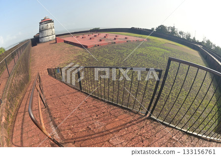 Aguada Fort is a built in 1612 along with a lighthouse, located on Sinquerim Beach in Goa, India, overlooking the Arabian Sea. The fort is a major tourist attraction. 133156761
