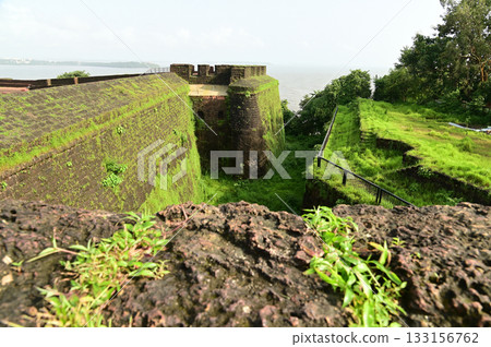Aguada Fort is a built in 1612 along with a lighthouse, located on Sinquerim Beach in Goa, India, overlooking the Arabian Sea. The fort is a major tourist attraction. Aguada Fort is a built in 1612 along with a lighthouse, located on Sinquerim Beach in Goa, India, overlooking the Arabian Sea. The fort is a major tourist attraction. 133156762
