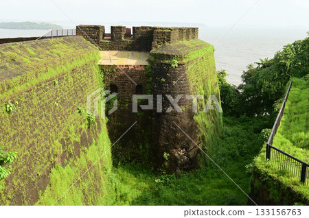 Aguada Fort is a built in 1612 along with a lighthouse, located on Sinquerim Beach in Goa, India, overlooking the Arabian Sea. The fort is a major tourist attraction. 133156763