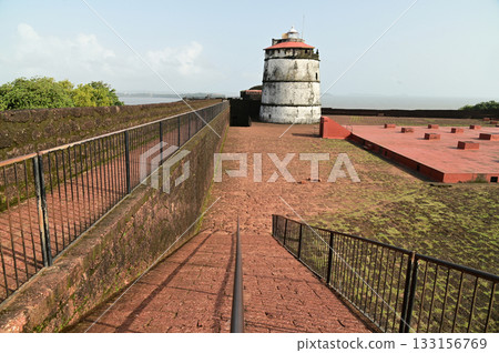 Aguada Fort is a built in 1612 along with a lighthouse, located on Sinquerim Beach in Goa, India, overlooking the Arabian Sea. The fort is a major tourist attraction. Aguada Fort is a built in 1612 along with a lighthouse, located on Sinquerim Beach in Goa, India, overlooking the Arabian Sea. The fort is a major tourist attraction. 133156769