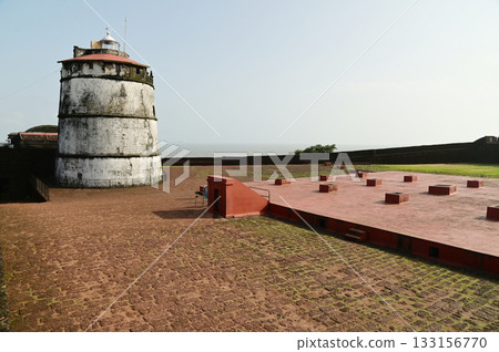 Aguada Fort is a built in 1612 along with a lighthouse, located on Sinquerim Beach in Goa, India, overlooking the Arabian Sea. The fort is a major tourist attraction. Aguada Fort is a built in 1612 along with a lighthouse, located on Sinquerim Beach in Goa, India, overlooking the Arabian Sea. The fort is a major tourist attraction. 133156770