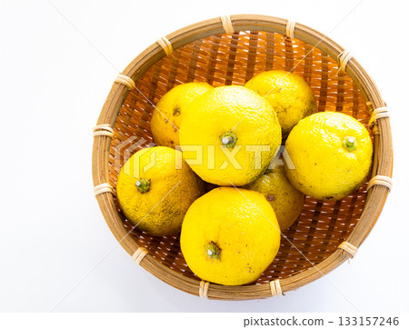 Harvested yuzu fruit in a monkey's Harvested yuzu fruit in a monkey's 133157246