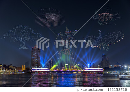 Memorial Bridge in new year drone show and projection mapping during the Vijit Chao Phraya festival performance on the Chao Phraya River in Bangkok, Thailand. Memorial Bridge in new year drone show and projection mapping during the Vijit Chao Phraya festival performance on the Chao Phraya River in Bangkok, Thailand. 133158716