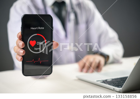 Smart healthcare concept featuring digital heart rate tracking on smartphone screen for remote medical diagnosis. Telehealth solution digital transformation mobile app technology innovation. Smart healthcare concept featuring digital heart rate tracking on smartphone screen for remote medical diagnosis. Telehealth solution digital transformation mobile app technology innovation. 133158856
